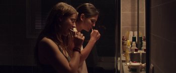 Movie still from “Breathe” (2014), directed by Mélanie Laurent – Two young women brushing their teeth in a bathroom; Close Up shot, Over the shoulder angle