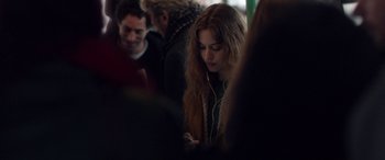 Movie still from “Breathe” (2014), directed by Mélanie Laurent – A woman is listening to music on her cell phone; Close Up shot, Over the shoulder angle