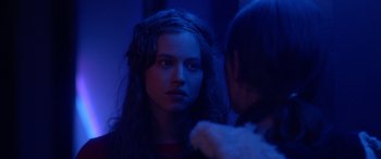 Movie still from “Breathe” (2014), directed by Mélanie Laurent – A woman looking into a mirror in a dark room; Close Up shot, Over the shoulder angle