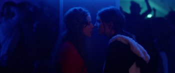 Movie still from “Breathe” (2014), directed by Mélanie Laurent – Two women are kissing each other in a dark room; Close Up shot, Overhead angle