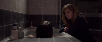 Movie still from “Breathe” (2014), directed by Mélanie Laurent – A woman sitting in a bath tub next to a young girl; Medium shot, Over the shoulder angle