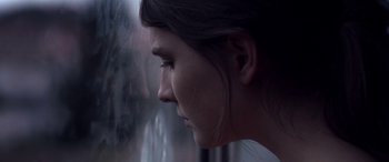 Movie still from “Breathe” (2014), directed by Mélanie Laurent – A person looking out of a window; Extreme Close Up shot, Over the shoulder angle