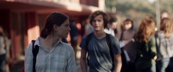 Movie still from “Breathe” (2014), directed by Mélanie Laurent – A man and a woman walking down a street; Medium shot, Over the shoulder angle