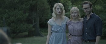 Movie still from “Breathe In” (2013), directed by Drake Doremus – Two young women standing next to each other in a field; Medium shot, Low angle