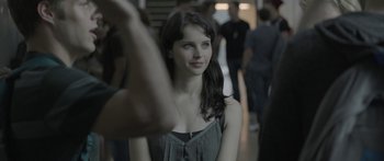 Movie still from “Breathe In” (2013), directed by Drake Doremus – A young woman taking a picture of herself in a hallway; Close Up shot, Over the shoulder angle