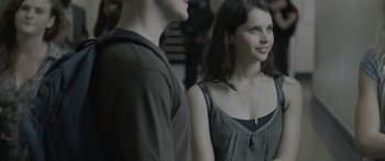 Movie still from “Breathe In” (2013), directed by Drake Doremus – A man and a woman standing next to each other; Close Up shot, Over the shoulder angle