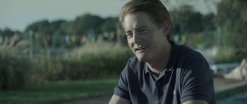 Movie still from “Breathe In” (2013), directed by Drake Doremus – A person wearing a polo shirt; Close Up shot, Over the shoulder angle