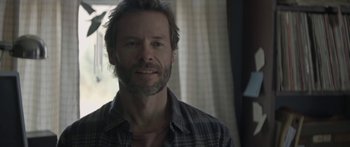 Movie still from “Breathe In” (2013), directed by Drake Doremus – A person wearing a plaid shirt; Close Up shot, Over the shoulder angle