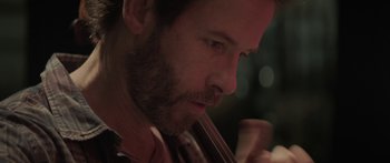 Movie still from “Breathe In” (2013), directed by Drake Doremus – A person playing a violin; Extreme Close Up shot, Over the shoulder angle