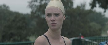 Movie still from “Breathe In” (2013), directed by Drake Doremus – A woman with a bandage on her head; Close Up shot, Over the shoulder angle