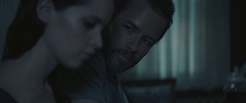 Movie still from “Breathe In” (2013), directed by Drake Doremus – A man and a woman's face; Close Up shot, Over the shoulder angle
