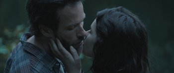 Movie still from “Breathe In” (2013), directed by Drake Doremus – A man and a woman kissing each other; Close Up shot, Over the shoulder angle
