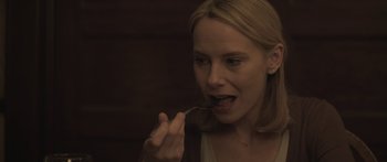 Movie still from “Breathe In” (2013), directed by Drake Doremus – A woman is eating something with a spoon; Close Up shot, High angle