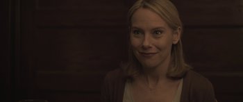 Movie still from “Breathe In” (2013), directed by Drake Doremus – A person smiling for the camera; Close Up shot, Over the shoulder angle