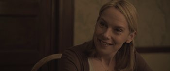 Movie still from “Breathe In” (2013), directed by Drake Doremus – A person sitting at a table; Close Up shot, Over the shoulder angle