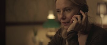 Movie still from “Breathe In” (2013), directed by Drake Doremus – A person talking on a cell phone; Close Up shot, Over the shoulder angle
