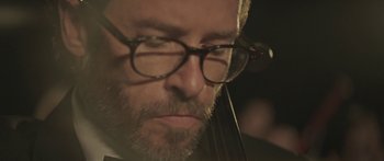 Movie still from “Breathe In” (2013), directed by Drake Doremus – A person wearing glasses; Extreme Close Up shot, Low angle