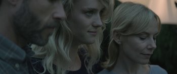Movie still from “Breathe In” (2013), directed by Drake Doremus – A woman's face with long blonde hair; Close Up shot, Over the shoulder angle