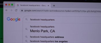 Movie still from “The Beta Test” (2021), directed by PJ McCabe – A computer screen with a search bar on it; Extreme Close Up shot, High angle