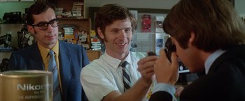 Movie still from “Brewster McCloud” (1970), directed by Robert Altman – A young man wearing a white shirt and a blue tie; Close Up shot, Over the shoulder angle