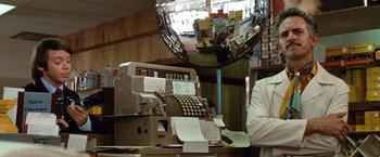 Movie still from “Brewster McCloud” (1970), directed by Robert Altman – An old fashioned cash register in a store; Medium shot, Low angle