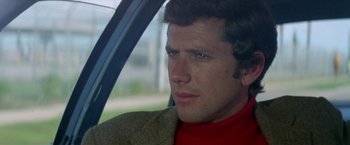 Movie still from “Brewster McCloud” (1970), directed by Robert Altman – A person in a car looking out of the window; Close Up shot, Low angle