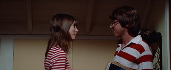 Movie still from “Brewster McCloud” (1970), directed by Robert Altman – A woman and a man talking to each other; Medium shot, Low angle