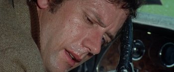 Movie still from “Brewster McCloud” (1970), directed by Robert Altman – A man's face covered in water; Extreme Close Up shot, Low angle