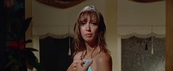 Movie still from “Brewster McCloud” (1970), directed by Robert Altman – A young woman holding her hands over her face; Close Up shot, Low angle