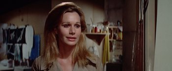 Movie still from “Brewster McCloud” (1970), directed by Robert Altman – A person with long blonde hair; Close Up shot, Over the shoulder angle