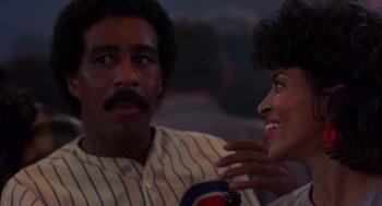 Movie still from “Brewster's Millions” (1985), directed by Walter Hill – A man and a woman talking to each other; Close Up shot, Over the shoulder angle