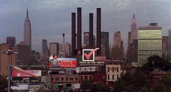 Movie still from “Brewster's Millions” (1985), directed by Walter Hill – A city skyline with a giant vote sign on top of it; Extreme Wide shot, High angle