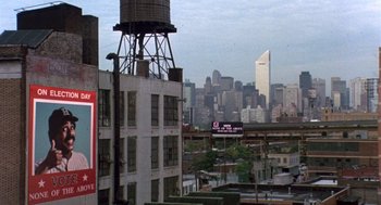 Movie still from “Brewster's Millions” (1985), directed by Walter Hill – A view of a city skyline from a high rise; Extreme Wide shot, High angle