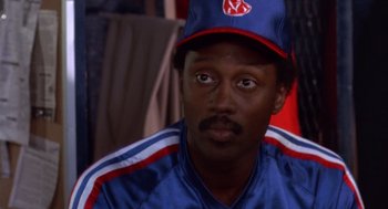 Movie still from “Brewster's Millions” (1985), directed by Walter Hill – A baseball player wearing a hat; Close Up shot, Over the shoulder angle