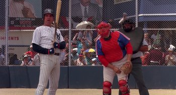 Movie still from “Brewster's Millions” (1985), directed by Walter Hill – Two baseball players standing next to each other on a baseball field; Medium shot, Over the shoulder angle