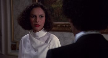 Movie still from “Brewster's Millions” (1985), directed by Walter Hill – A woman in a white shirt and a man in a black suit; Close Up shot, Over the shoulder angle