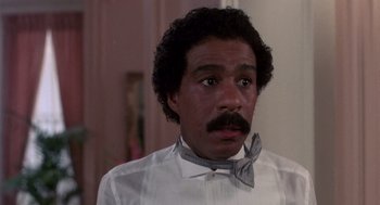 Movie still from “Brewster's Millions” (1985), directed by Walter Hill – A person wearing a bow tie; Close Up shot, Low angle