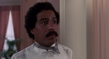 Movie still from “Brewster's Millions” (1985), directed by Walter Hill – A person wearing a bow tie; Close Up shot, Low angle