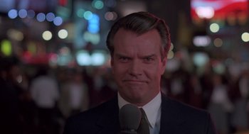 Movie still from “Brewster's Millions” (1985), directed by Walter Hill – A person wearing a suit and tie; Close Up shot, Low angle