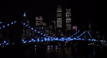 Movie still from “Brewster's Millions” (1985), directed by Walter Hill – A view of a city lit up at night; Extreme Wide shot, High angle