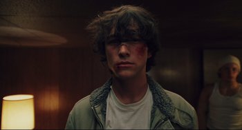 Movie still from “Brick” (2005), directed by Rian Johnson – A young man with a bandage on his face; Close Up shot, Low angle