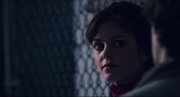 Movie still from “Brick” (2005), directed by Rian Johnson – A person looking at the camera; Close Up shot, Over the shoulder angle