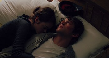 Movie still from “Brick” (2005), directed by Rian Johnson – A man and a woman laying in a bed together; Close Up shot, Overhead angle