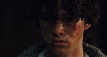 Movie still from “Brick” (2005), directed by Rian Johnson – A person with a bruise on his face; Close Up shot, Low angle