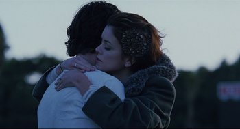 Movie still from “Brick” (2005), directed by Rian Johnson – A man and a woman embracing each other; Close Up shot, Over the shoulder angle