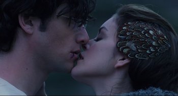 Movie still from “Brick” (2005), directed by Rian Johnson – A man and a woman are kissing each other; Close Up shot, Over the shoulder angle