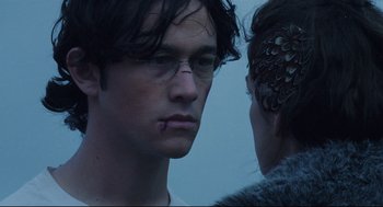 Movie still from “Brick” (2005), directed by Rian Johnson – A man and a woman face to face in front of a sky background; Close Up shot, Over the shoulder angle