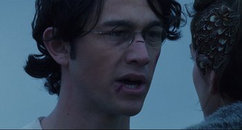 Movie still from “Brick” (2005), directed by Rian Johnson – A person wearing glasses; Close Up shot, Over the shoulder angle
