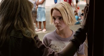 Movie still from “Bridge to Terabithia” (2007), directed by Gabor Csupo – A young girl getting her hair cut by a stylist; Close Up shot, Over the shoulder angle