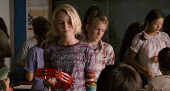 Movie still from “Bridge to Terabithia” (2007), directed by Gabor Csupo – Two young people standing next to each other in front of a wall; Medium shot, Over the shoulder angle